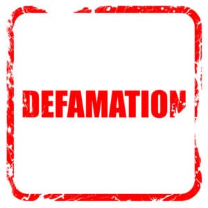 57088399 - defamation, red rubber stamp with grunge edges